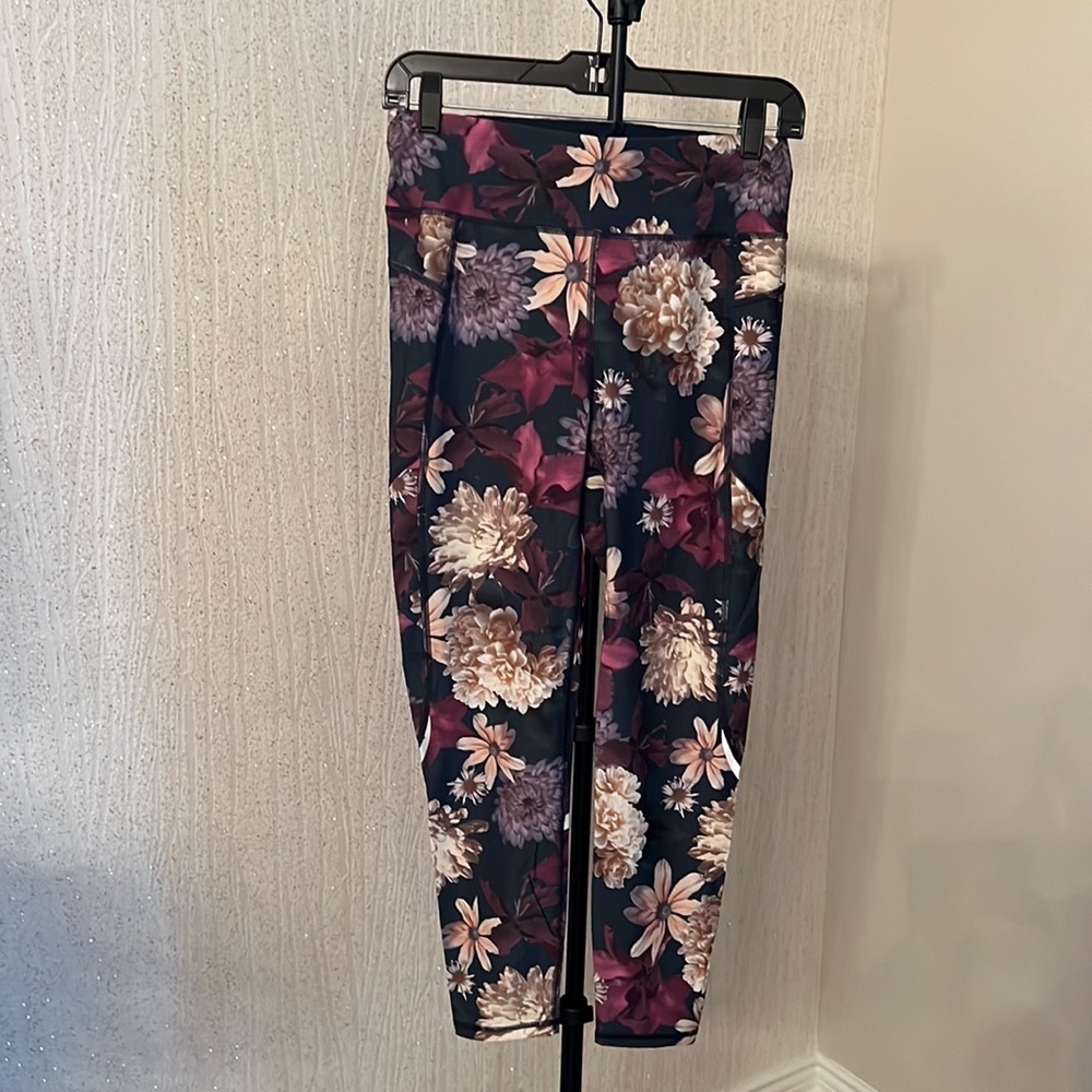 Sweaty Betty Zero Gravity Floral Cropped Leggings with reflective details.